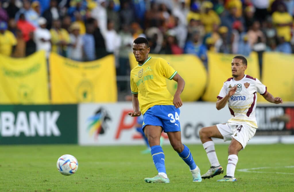 Mothobi Mvala of Mamelodi Sundowns is challenged by Devin Titus of Stellenbosch FC during the 2023 Nedbank Cup quarterfinal